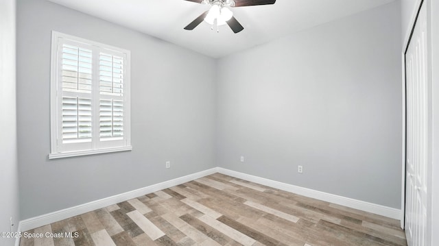 5852 Goleta Cir, Melbourne, FL 32940 - empty room with light wood-type flooring, a ceiling fan, and baseboards