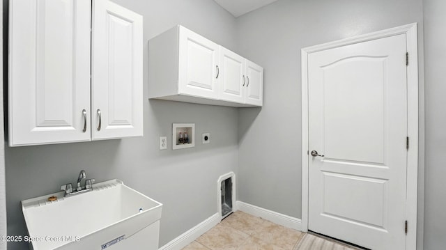 5852 Goleta Cir, Melbourne, FL 32940 - washroom featuring washer hookup, cabinet space, hookup for an electric dryer, baseboards, and light tile patterned floors
