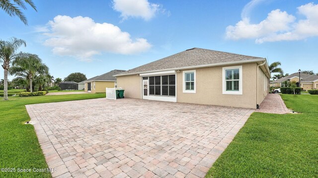 5852 Goleta Cir, Melbourne, FL 32940 - rear view of house featuring stucco siding, a yard, and a patio