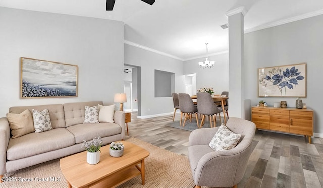5852 Goleta Cir, Melbourne, FL 32940 - living area featuring light wood-style floors, ornamental molding, a chandelier, baseboards, and ceiling fan