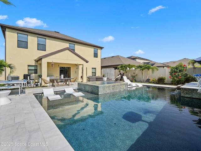 4647 Broomsedge Cir, West Melbourne, FL 32904 - view of swimming pool featuring outdoor dining space, a fenced backyard, a patio area, and a pool with connected hot tub