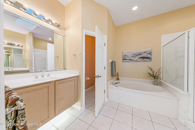 8051 Daventry Dr, Melbourne, FL 32940 - bathroom featuring tile patterned flooring, a bath, vanity, and a shower