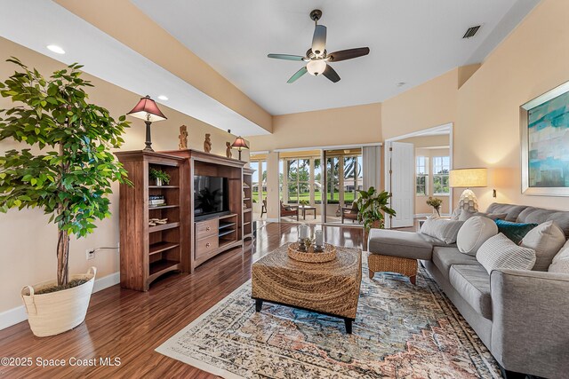 8051 Daventry Dr, Melbourne, FL 32940 - living room featuring a ceiling fan, dark wood-style floors, healthy amount of natural light, baseboards, and recessed lighting