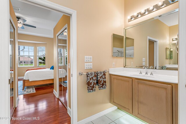 8051 Daventry Dr, Melbourne, FL 32940 - bathroom with vanity, a ceiling fan, and baseboards