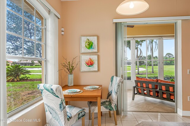 8051 Daventry Dr, Melbourne, FL 32940 - dining space with light tile patterned floors