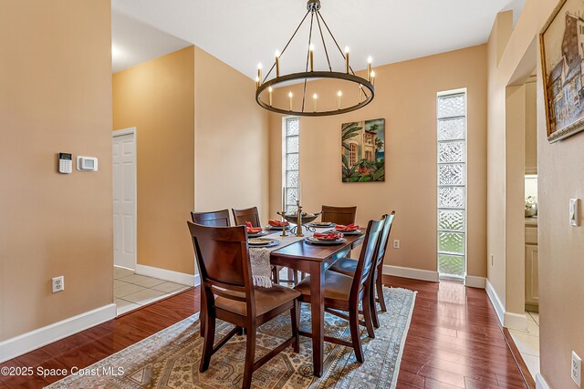 8051 Daventry Dr, Melbourne, FL 32940 - dining room with a chandelier, healthy amount of natural light, and wood finished floors