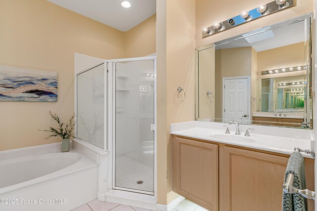 8051 Daventry Dr, Melbourne, FL 32940 - bathroom with a shower stall, a garden tub, vanity, and tile patterned floors