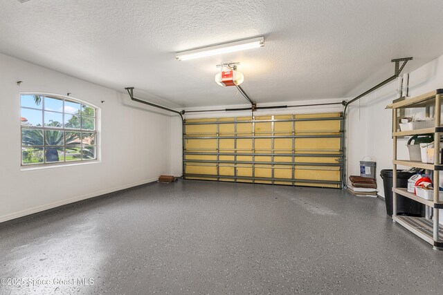 8051 Daventry Dr, Melbourne, FL 32940 - garage featuring baseboards and a garage door opener