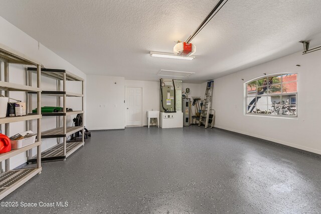 8051 Daventry Dr, Melbourne, FL 32940 - garage featuring a garage door opener, electric water heater, heating unit, baseboards, and a sink