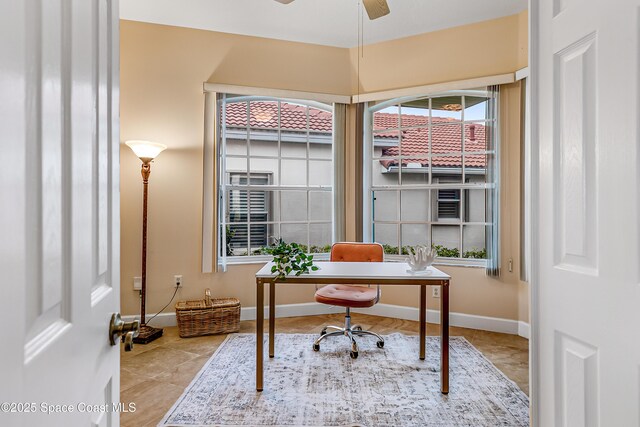 8051 Daventry Dr, Melbourne, FL 32940 - office area with tile patterned floors, ceiling fan, and baseboards