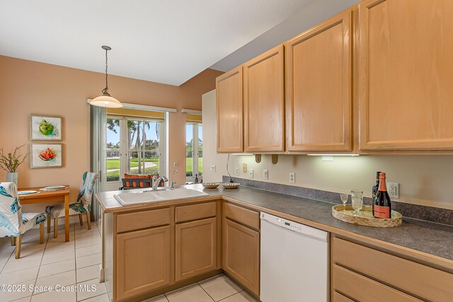 8051 Daventry Dr, Melbourne, FL 32940 - kitchen featuring dishwasher, a sink, light tile patterned floors, a peninsula, and dark countertops