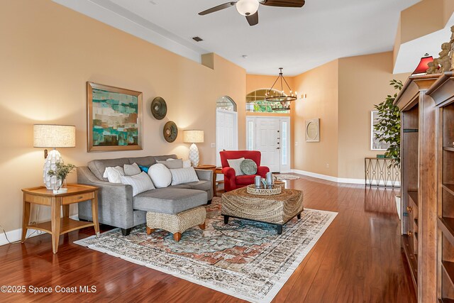 8051 Daventry Dr, Melbourne, FL 32940 - living area featuring wood finished floors, a chandelier, ceiling fan, and baseboards