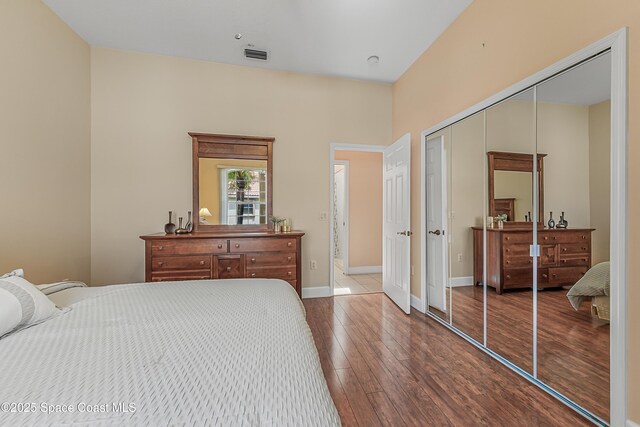 8051 Daventry Dr, Melbourne, FL 32940 - bedroom with hardwood / wood-style floors, a closet, and baseboards