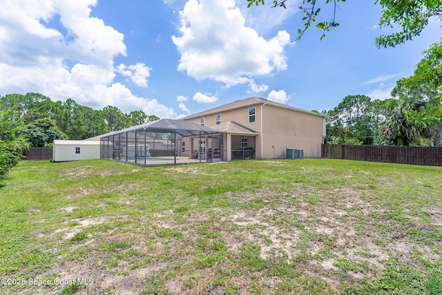 2501 Eldron Blvd SE, Palm Bay, FL 32909 - back of house with cooling unit, a lanai, stucco siding, and a patio area