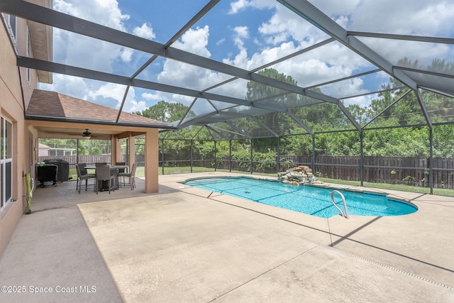 2501 Eldron Blvd SE, Palm Bay, FL 32909 - view of swimming pool featuring a patio area, a fenced backyard, outdoor dining space, and glass enclosure
