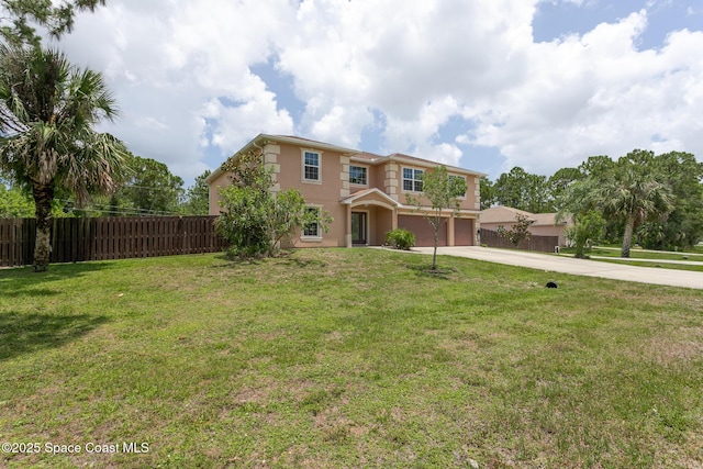 2501 Eldron Blvd SE, Palm Bay, FL 32909 - traditional home featuring an attached garage, driveway, and stucco siding