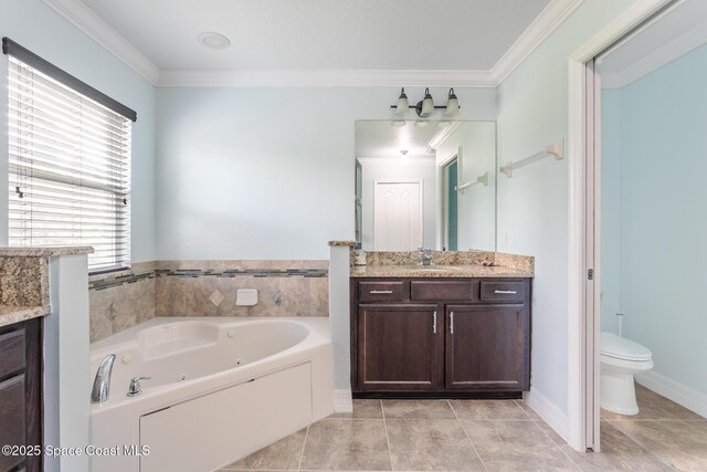 2501 Eldron Blvd SE, Palm Bay, FL 32909 - bathroom featuring vanity, a whirlpool tub, ornamental molding, toilet, and tile patterned floors
