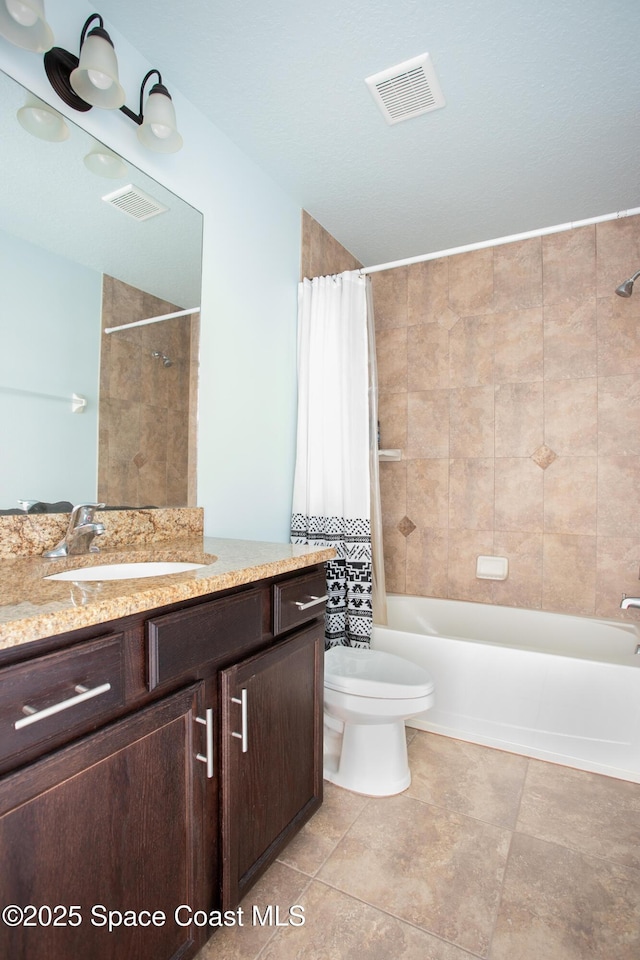 2501 Eldron Blvd SE, Palm Bay, FL 32909 - full bath with vanity, shower / bath combination with curtain, toilet, and tile patterned flooring