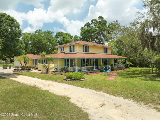 2280 Grove St, Titusville, FL 32796 - farmhouse with a porch, driveway, and a front lawn