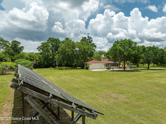 2280 Grove St, Titusville, FL 32796 - view of green lawn with a garage