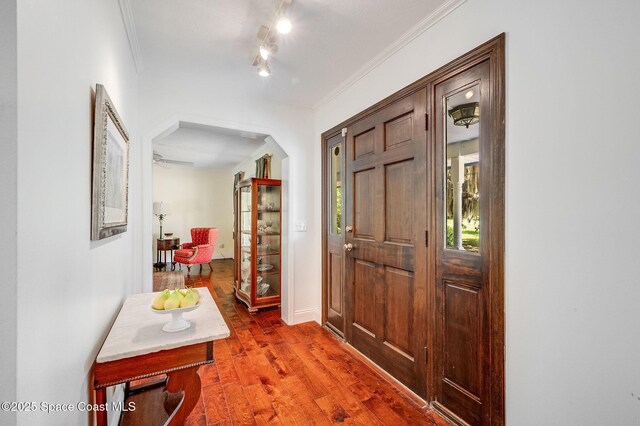 2280 Grove St, Titusville, FL 32796 - foyer featuring ornamental molding, wood finished floors, and baseboards