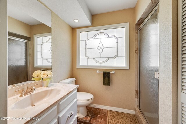 2280 Grove St, Titusville, FL 32796 - bathroom with vanity, toilet, plenty of natural light, and a shower stall