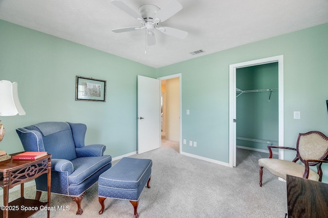 2280 Grove St, Titusville, FL 32796 - living area with a ceiling fan, carpet floors, and baseboards