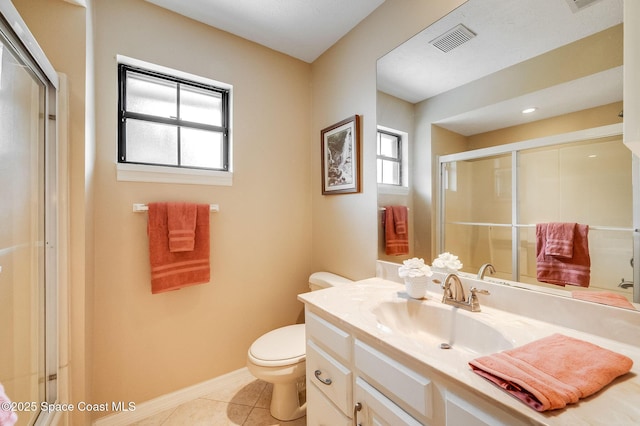 2280 Grove St, Titusville, FL 32796 - bathroom with vanity, toilet, a shower with door, tile patterned floors, and baseboards
