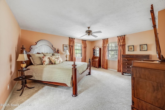 2280 Grove St, Titusville, FL 32796 - bedroom featuring light carpet, baseboards, a ceiling fan, and a textured ceiling
