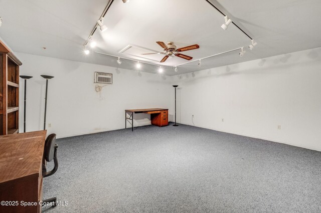 2280 Grove St, Titusville, FL 32796 - garage with ceiling fan, a wall mounted AC, and baseboards