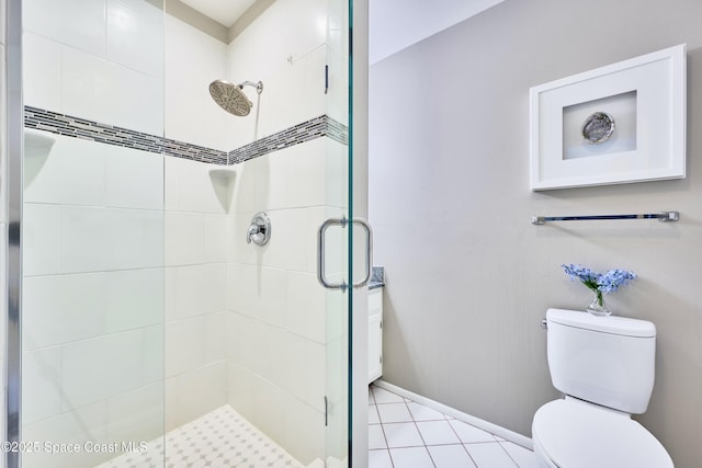 70 Royal Oak Ct Unit 206, Vero Beach, FL 32962 - full bath featuring a stall shower, toilet, baseboards, and tile patterned flooring