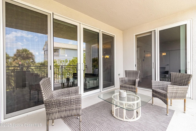 6015 Turtle Beach Ln Unit 204, Cocoa Beach, FL 32931 - view of patio with a balcony