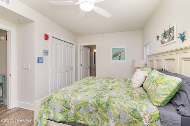 6015 Turtle Beach Ln Unit 204, Cocoa Beach, FL 32931 - bedroom featuring wood finished floors, baseboards, ceiling fan, and a closet