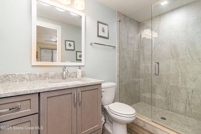 6015 Turtle Beach Ln Unit 204, Cocoa Beach, FL 32931 - bathroom with toilet, vanity, and a stall shower
