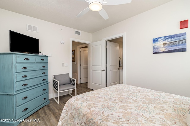 6015 Turtle Beach Ln Unit 204, Cocoa Beach, FL 32931 - bedroom with dark wood-type flooring and ceiling fan