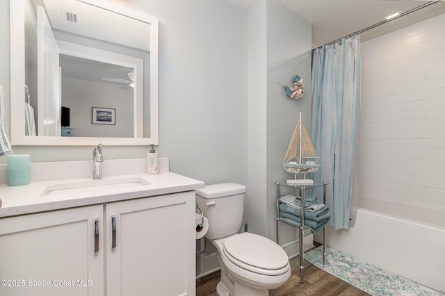 6015 Turtle Beach Ln Unit 204, Cocoa Beach, FL 32931 - full bath with wood finished floors, vanity, toilet, and shower / bath combo with shower curtain