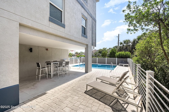 6015 Turtle Beach Ln Unit 204, Cocoa Beach, FL 32931 - view of swimming pool featuring a patio area