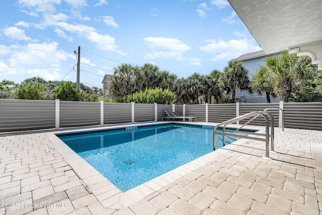 6015 Turtle Beach Ln Unit 204, Cocoa Beach, FL 32931 - view of swimming pool featuring a patio area and a fenced backyard