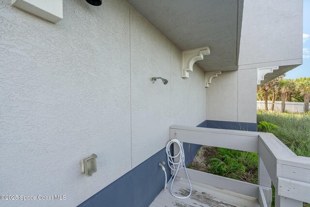 6015 Turtle Beach Ln Unit 204, Cocoa Beach, FL 32931 - exterior view of stucco siding