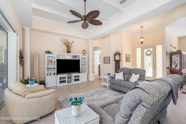 140 Miami Ave, Indialantic, FL 32903 - living area featuring ornate columns, a ceiling fan, light tile patterned flooring, arched walkways, and a towering ceiling