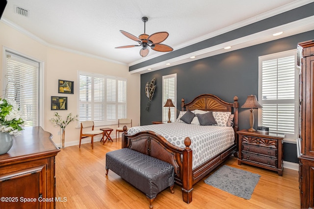 140 Miami Ave, Indialantic, FL 32903 - bedroom with crown molding, light wood-style floors, baseboards, and ceiling fan