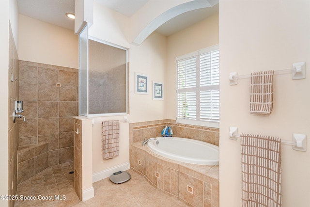140 Miami Ave, Indialantic, FL 32903 - full bathroom featuring a bath, tiled shower, and tile patterned floors