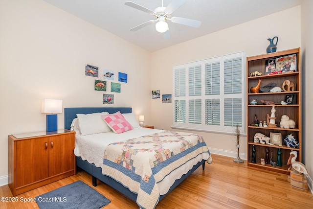 140 Miami Ave, Indialantic, FL 32903 - bedroom featuring light wood finished floors, baseboards, and a ceiling fan
