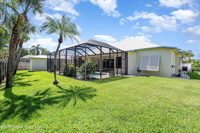 140 Miami Ave, Indialantic, FL 32903 - rear view of property with stucco siding, an outdoor pool, a lanai, a patio, and metal roof