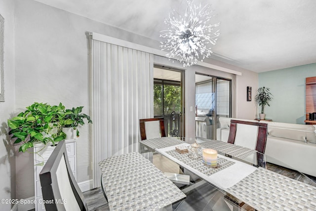 9040 York Ln Unit 16G, West Melbourne, FL 32904 - dining space featuring a chandelier and wood finished floors