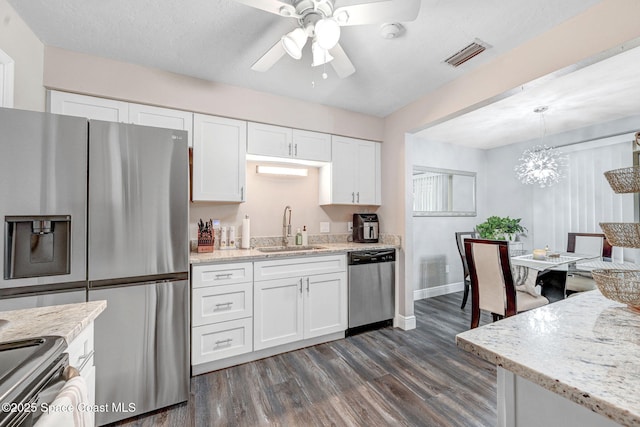 9040 York Ln Unit 16G, West Melbourne, FL 32904 - kitchen featuring a sink, appliances with stainless steel finishes, dark wood-type flooring, ceiling fan, and white cabinets
