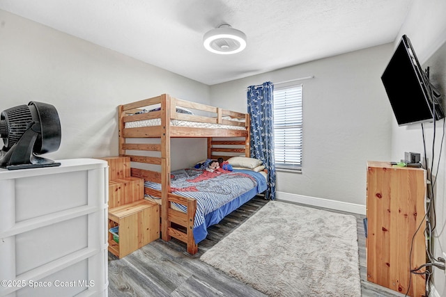 9040 York Ln Unit 16G, West Melbourne, FL 32904 - bedroom with wood finished floors and baseboards