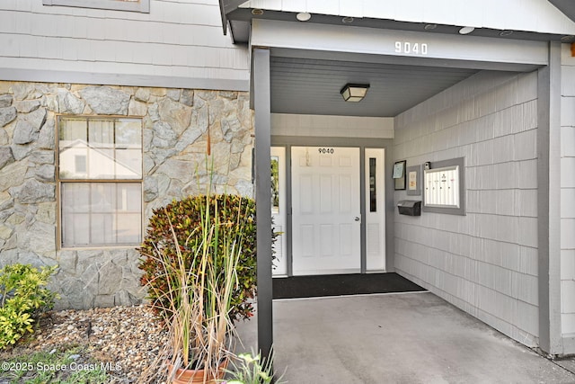 9040 York Ln Unit 16G, West Melbourne, FL 32904 - property entrance with stone siding