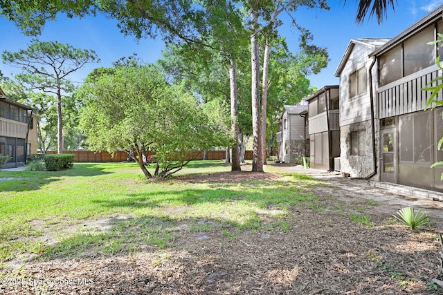 9040 York Ln Unit 16G, West Melbourne, FL 32904 - view of yard with a sunroom