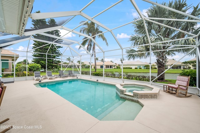 274 Clyde St, Melbourne Beach, FL 32951 - view of swimming pool featuring a patio, a pool with connected hot tub, and glass enclosure